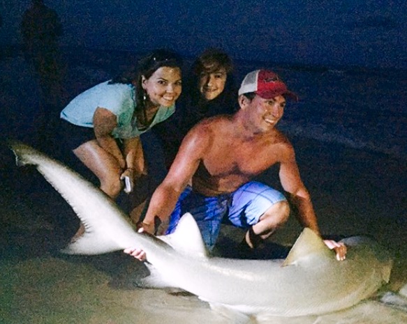 A lemon shark. Kristin, Jake's girlfriend and fishing mate is on the left.
